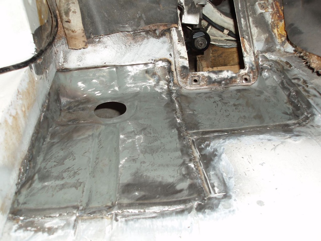 Driver's side front floor welded in patches.jpg